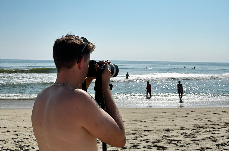 Image of tyler taking pictures on the Beach in Nantucket